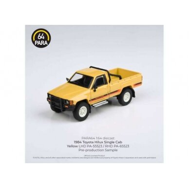 Para64 Modeliukas 1/64 1984 Toyota Hilux Single Cab, yellow left hand drive (cars in a deluxe Acrylic window box)